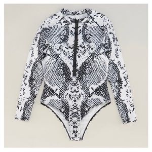 White/black animal print oncie